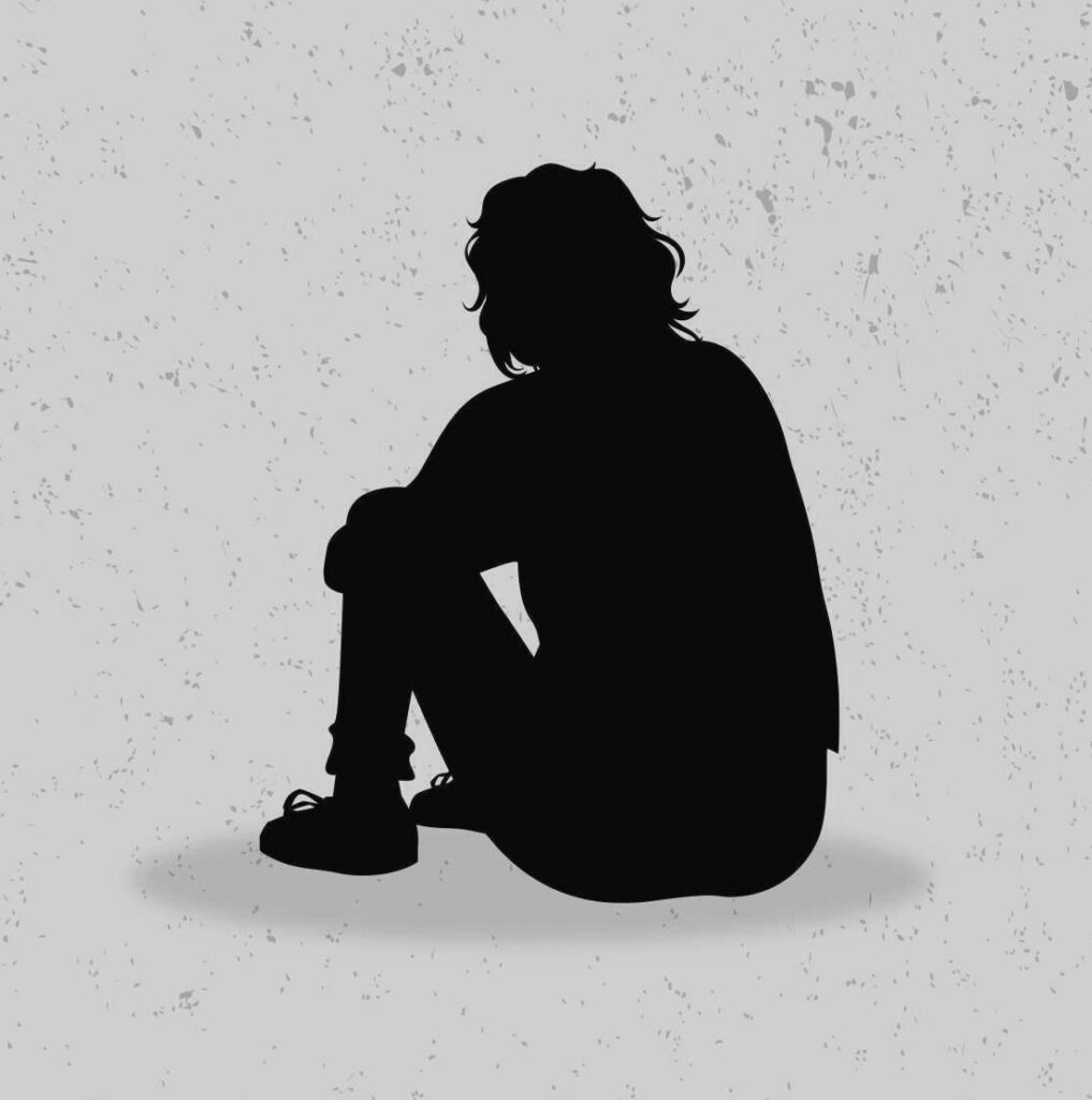 Person sitting alone contemplating life